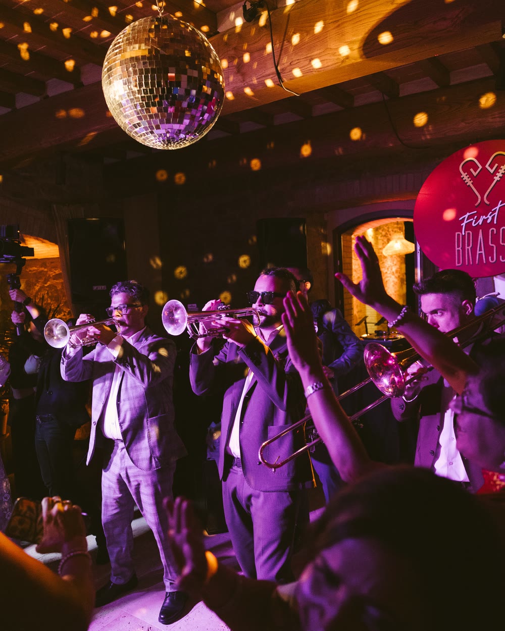 Guests dancing under a mirror ball